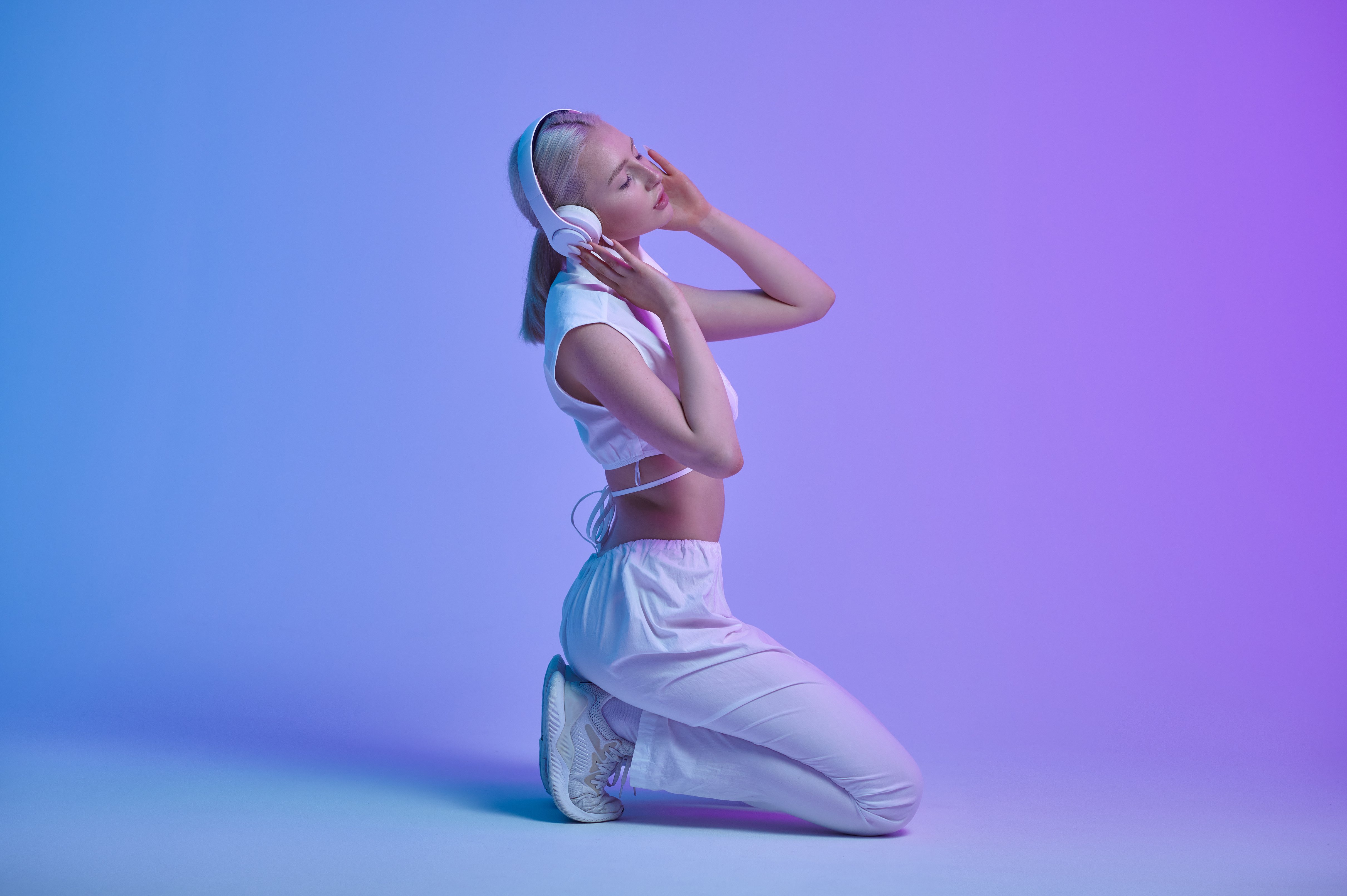 Attractive Futuristic Woman Listens to Music